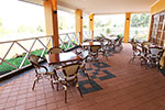 Some tables and chairs on the verandah.